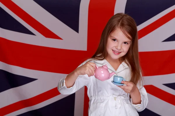 Girl on a background of the flag UK — Stock Photo, Image