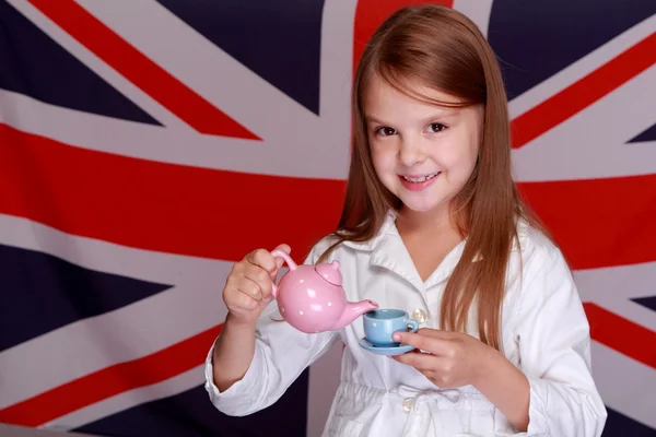 Chica en un fondo de la bandera del Reino Unido —  Fotos de Stock