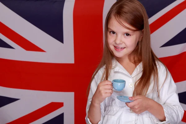 Girl on the background of the flag of Great Britain — Stock Photo, Image