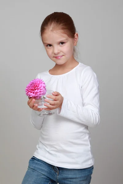 Little girl holding a fresh flower — Stock Photo, Image