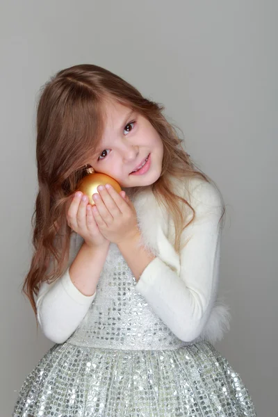 Little girl holding Christmas decoration — Stock Photo, Image