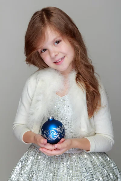 Little girl holding Christmas decoration — Stock Photo, Image