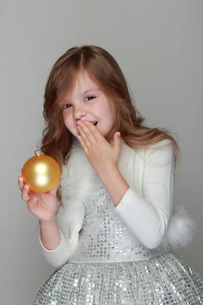 Girl holding a Christmas ball — Stock Photo, Image