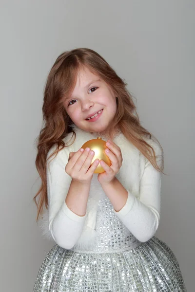 Girl holding a Christmas ball — Stock Photo, Image