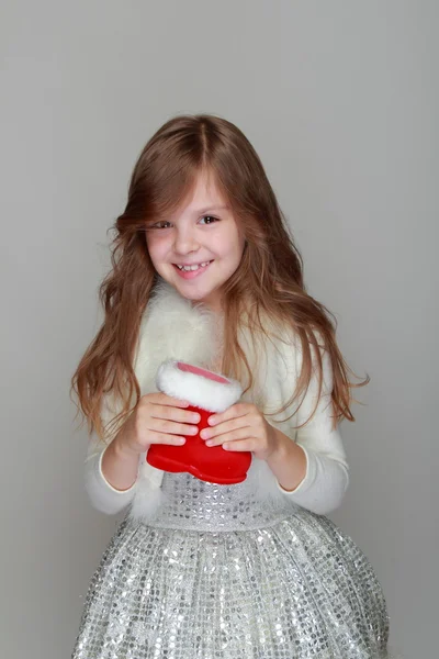 Girl holding christmas red boot — Stock Photo, Image