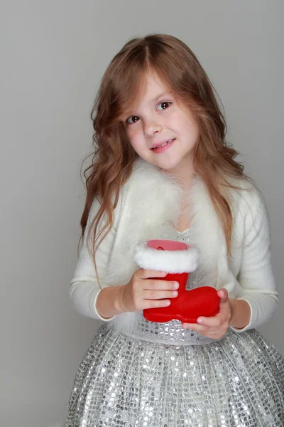 Girl holding christmas red boot — Stock Photo, Image