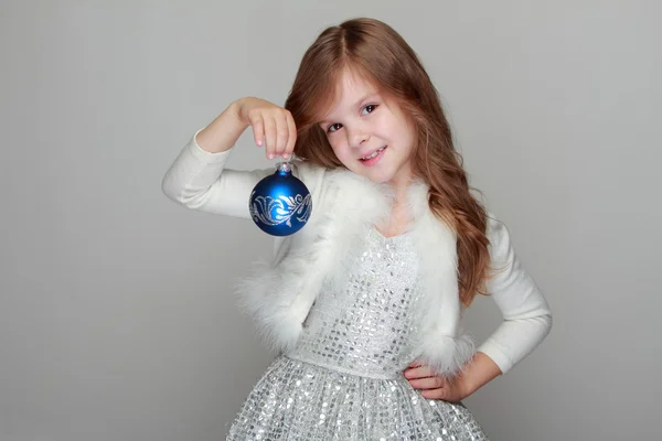 Girl holding a Christmas decoration — Stock Photo, Image