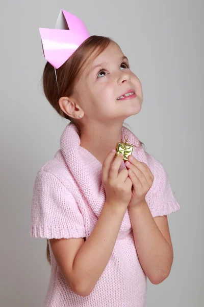 Little girl in a pink knitted dress — Stok fotoğraf
