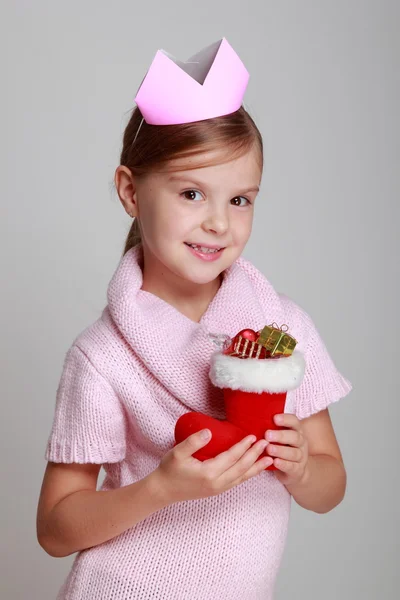 Child holding Christmas boot — Stock Photo, Image