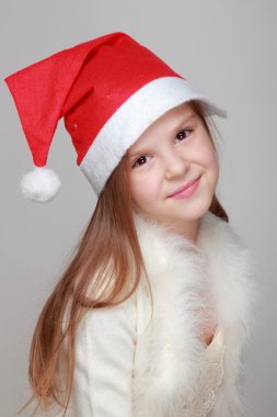 Noel Baba şapkalı kız.