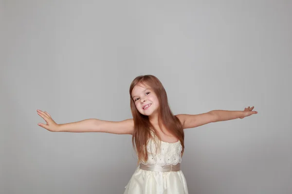 Girl is dancing on a gray background — Stock Photo, Image