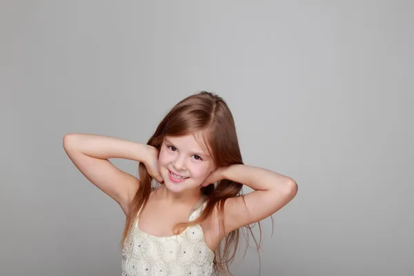 Girl having fun on a gray background — Stock Photo, Image