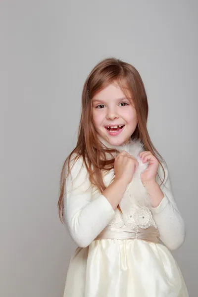 Girl having fun on a gray background — Stock Photo, Image