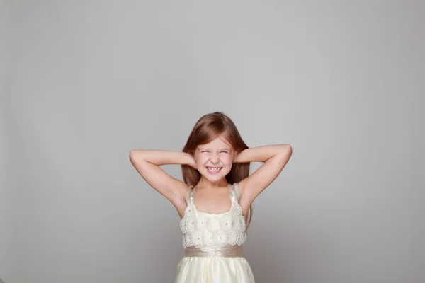 girl laughing on a gray background