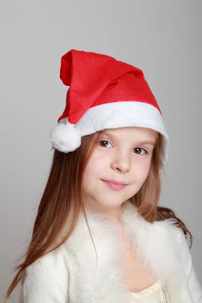 Girl in Santa's hat Royalty Free Stock Photos