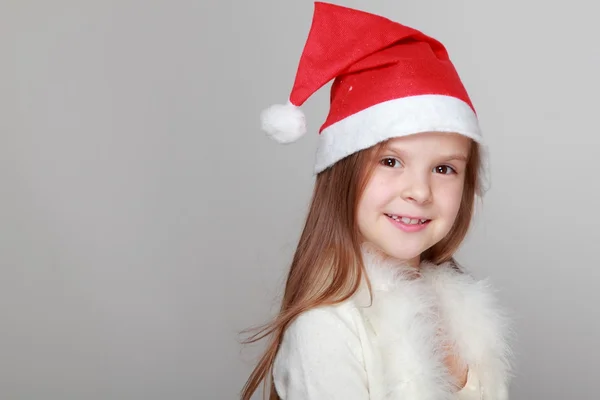 在圣诞老人的帽子的女孩 — 图库照片