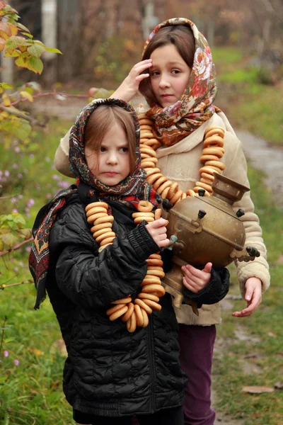 Young girls at autumn lanscape — Stock Photo, Image