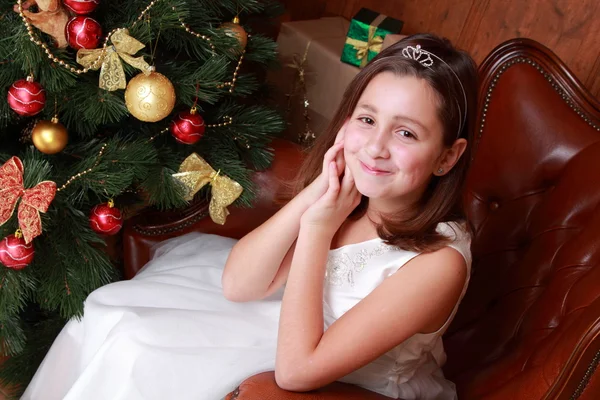 Little girl over Christmas tree Royalty Free Stock Images