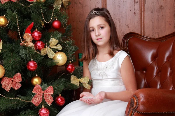 Little girl over Christmas tree — Stock Photo, Image