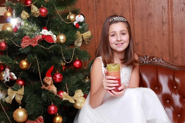 Little girl with candle on Christmas — Stock Photo, Image