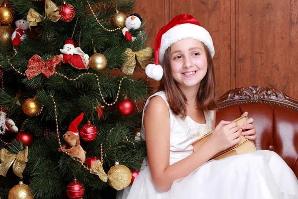 Little girl holding books Stock Photo