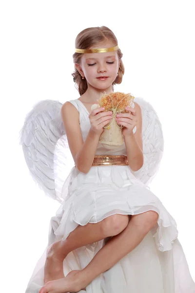 Pequeno anjo segurando anjo boneca — Fotografia de Stock