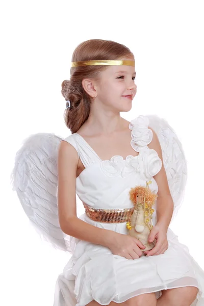 Little angel holding angel doll — Stock Photo, Image