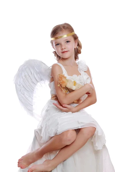 Little angel holding angel doll Stock Picture