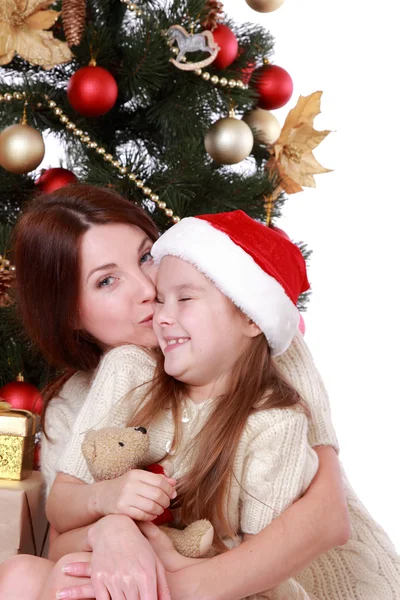 Mother and child girl in Santa hats — Stock Photo, Image