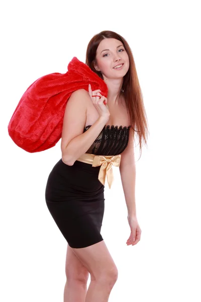 Mujer joven sosteniendo Santa Bag — Foto de Stock