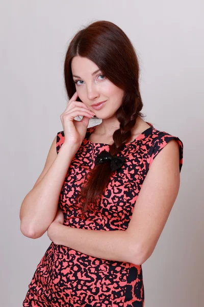 Beautiful woman wearing colorful dress — Stock Photo, Image