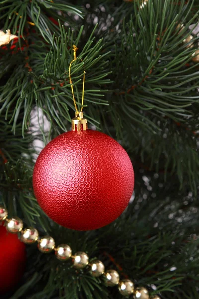 Red ball on Christmas tree — Stock Photo, Image