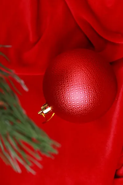 Red ball on Christmas tree — Stock Photo, Image