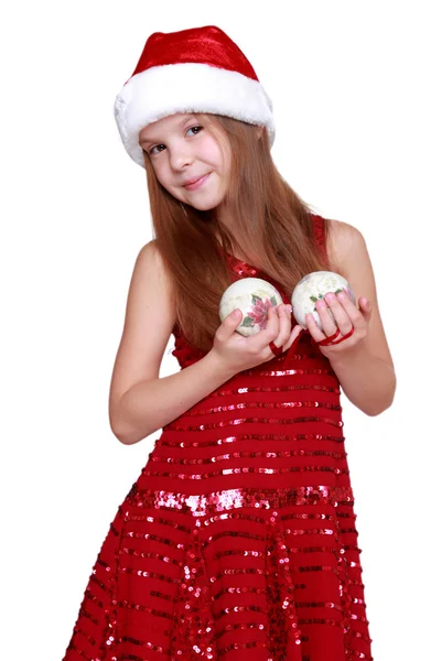 Little girl in Santa hat on Holiday theme — Stock Photo, Image