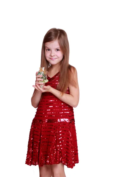 Little girl holding decorative doll — Stock Photo, Image