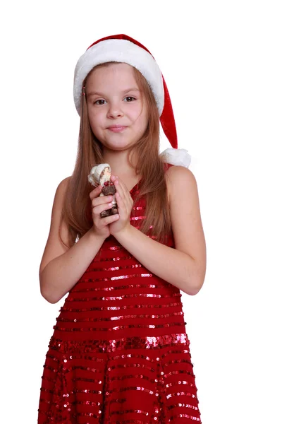 Niña con muñeca decorativa en Navidad — Foto de Stock