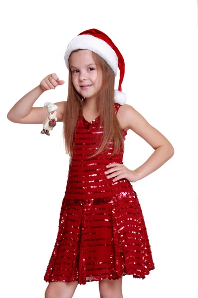 Bambina con bambola decorativa a Natale — Foto Stock