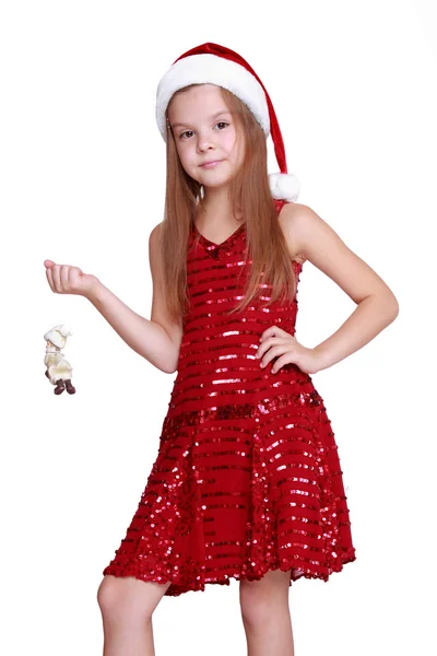 Niña con muñeca decorativa en Navidad — Foto de Stock