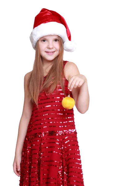 Holčička drží vánoční koule — Stock fotografie