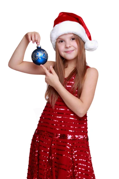 Holčička drží vánoční koule — Stock fotografie