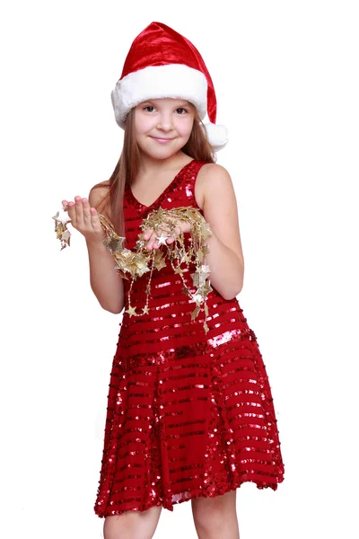 Маленькая девочка с золотыми звёздами Рождества — стоковое фото