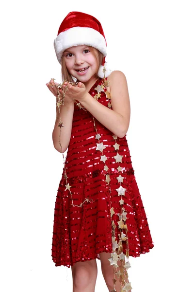 Liten flicka håller jul guldstjärnor — Stock fotografie