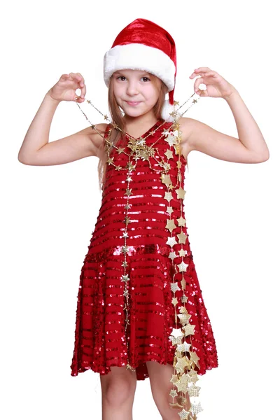 Little girl holding christmas golden stars — Stock Photo, Image