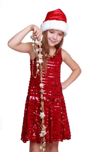 Little girl holding christmas golden stars — Stock Photo, Image