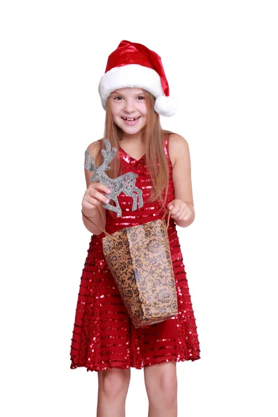 Little girl smiling with gift bag Stock Photo