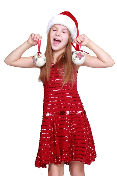 Little girl holding christmas balls — Stock Photo, Image