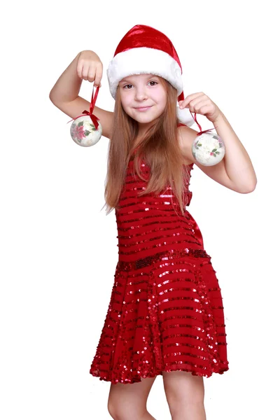 Bambina che tiene le palle di Natale — Foto Stock