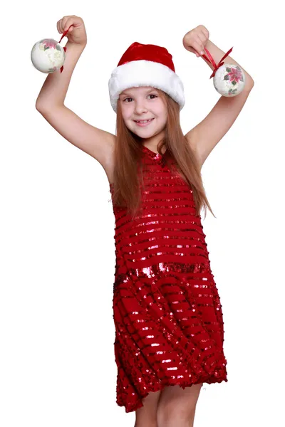 Little girl holding christmas balls — Stock Photo, Image