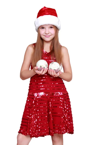 Little girl in Santa hat on Holiday theme — Stock Photo, Image