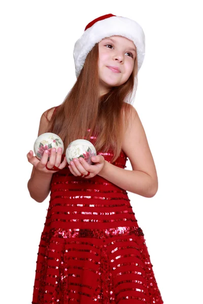 Petite fille dans le chapeau de Père Noël sur le thème des vacances — Photo